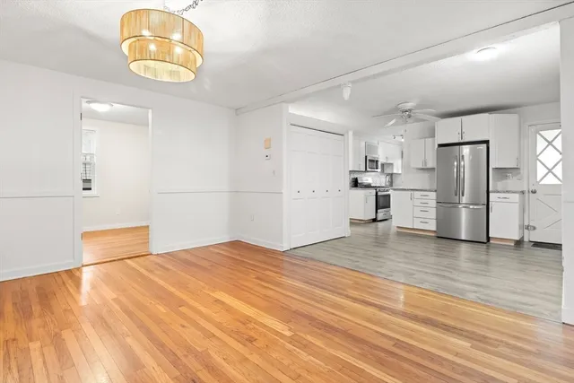 a view of a kitchen with a dishwasher and a refrigerator