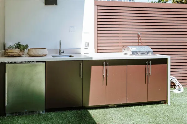 a kitchen with a sink and a window