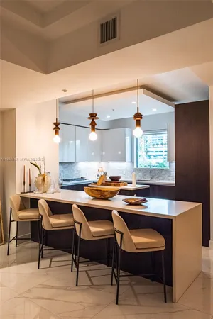 a room with a table chairs and a wooden floor