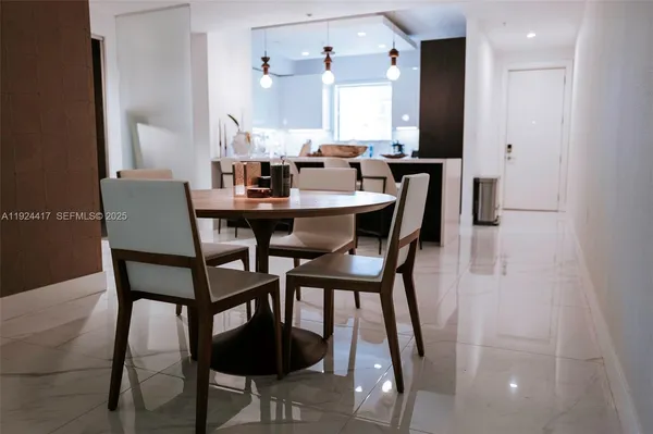 a dining room with furniture and window