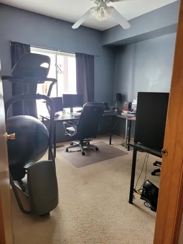 a workspace with furniture and a window