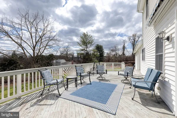 a view of a patio with a table and chairs