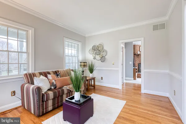 a living room with furniture rug and window