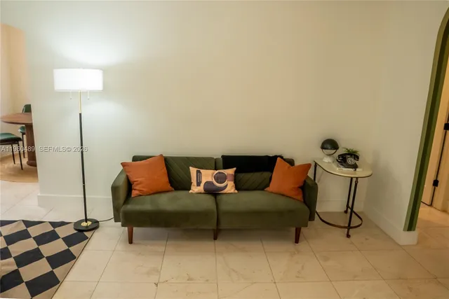 a living room with furniture and a rug