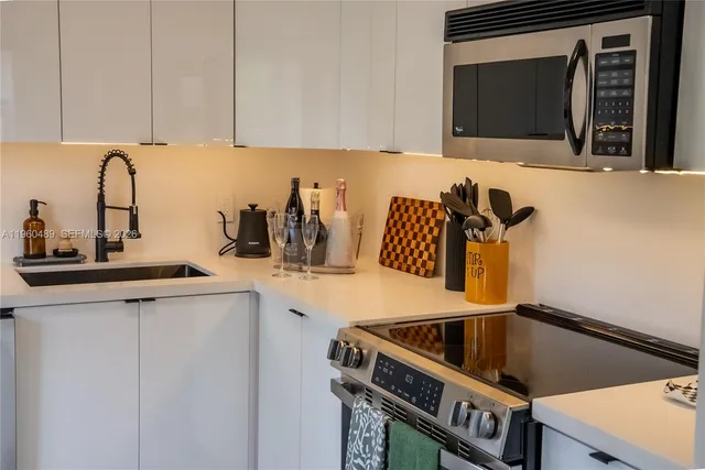 a kitchen with a sink and cabinets