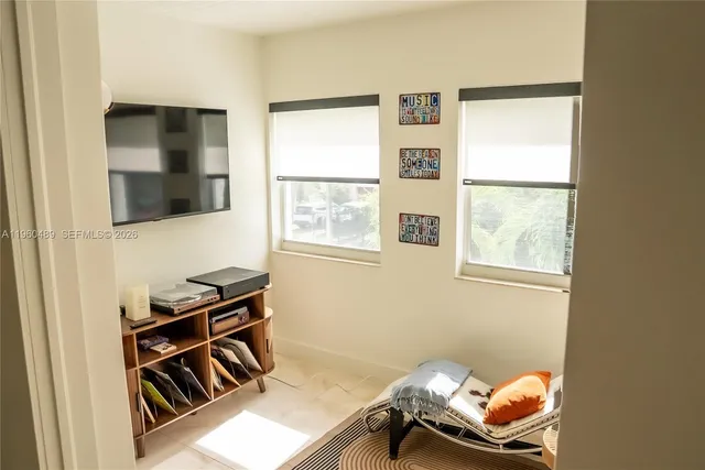 a room with chair and window