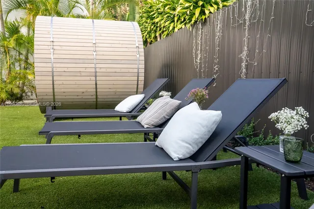 a view of a two chairs in the patio