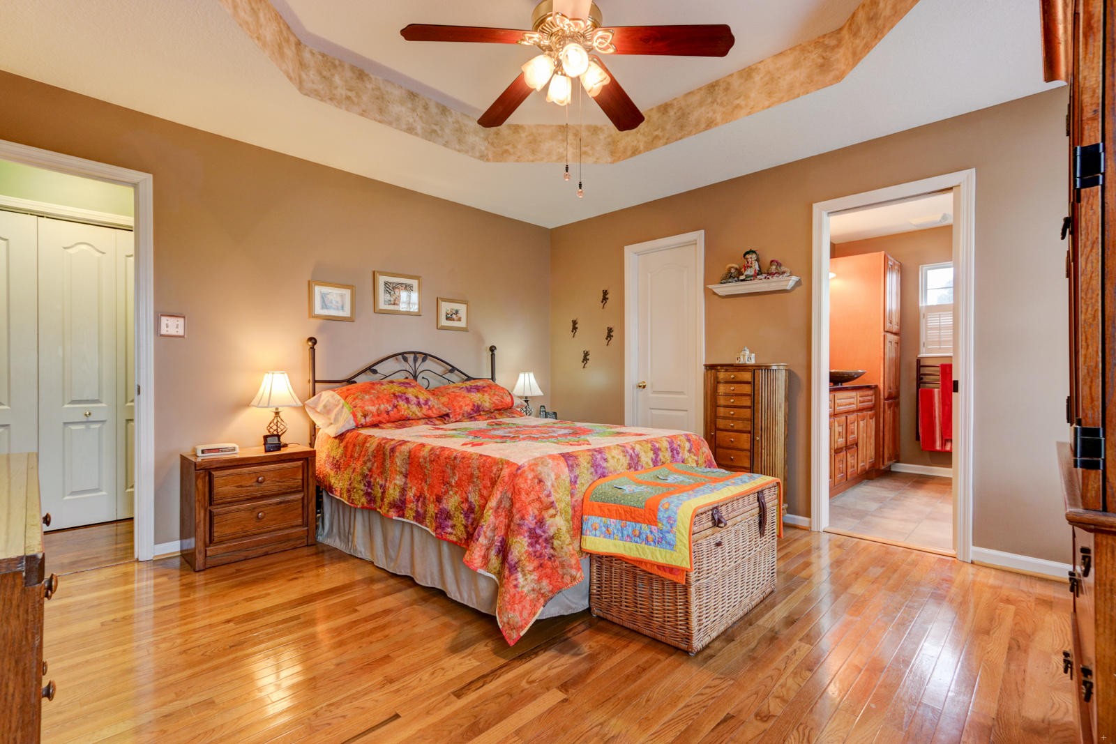 447 Pecan Circle Corryton, TN 37721 - Photo 13 of 28 a spacious bedroom with a bed and a chandelier