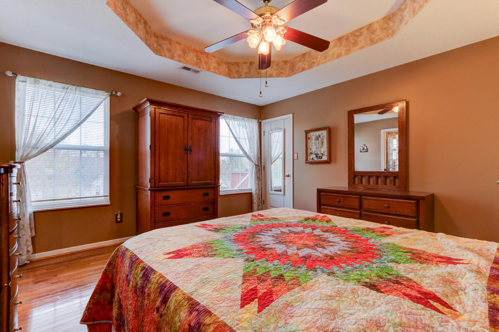 447 Pecan Circle Corryton, TN 37721 - Photo 16 of 28 a bedroom with a bed and a chandelier