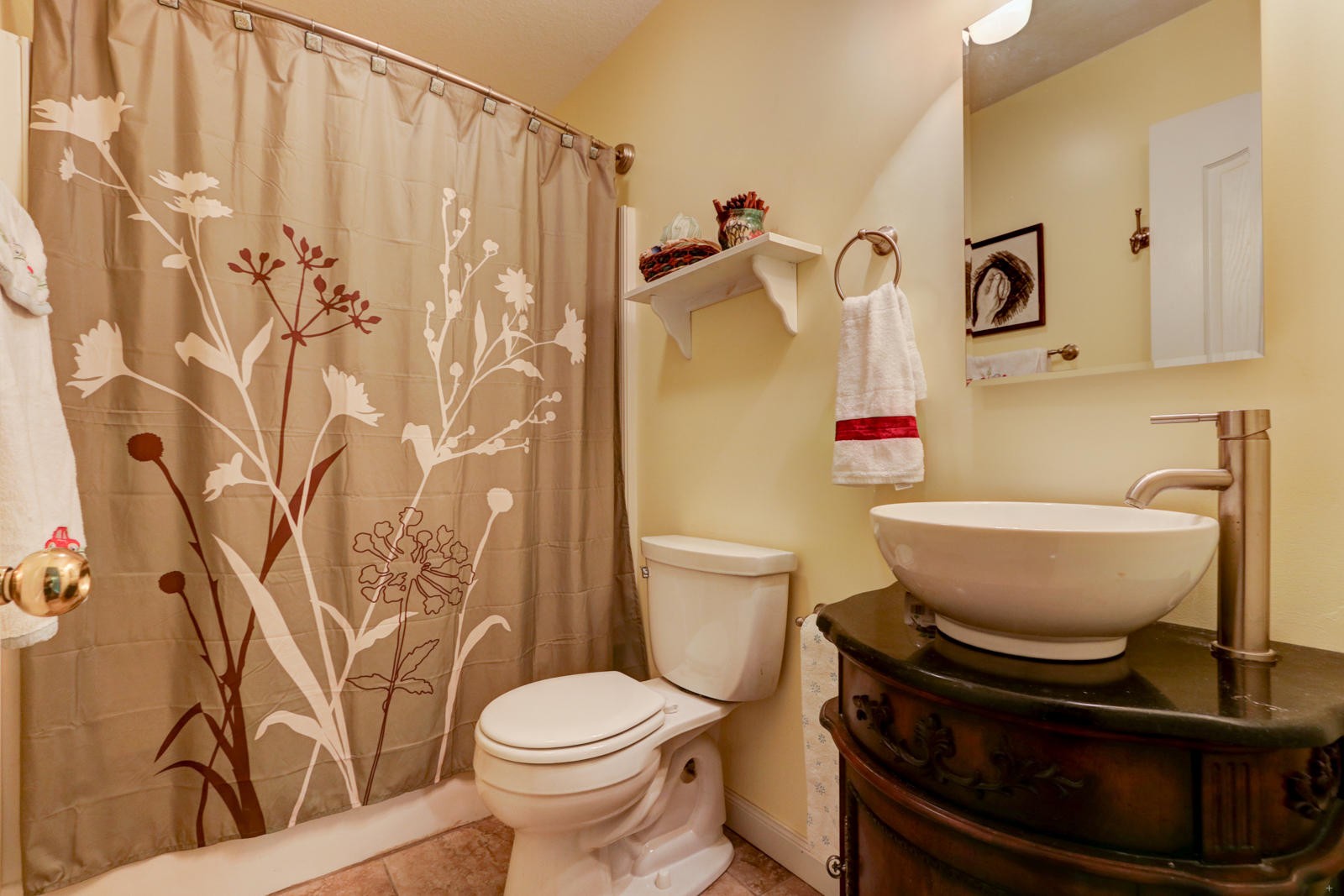 447 Pecan Circle Corryton, TN 37721 - Photo 18 of 28 a bathroom with a toilet and a shower curtain
