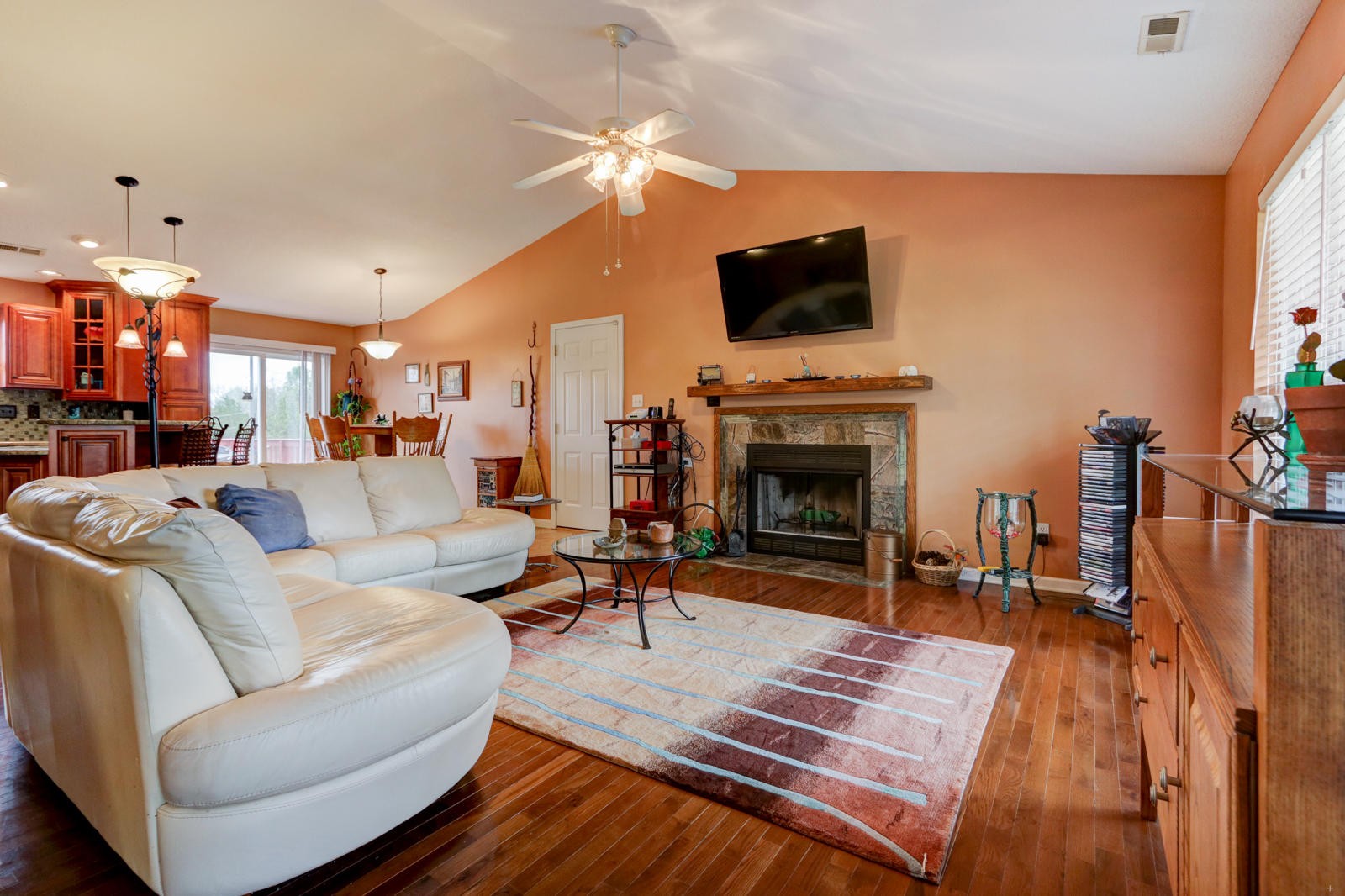 447 Pecan Circle Corryton, TN 37721 - Photo 4 of 28 a living room with furniture a fireplace and a flat screen tv