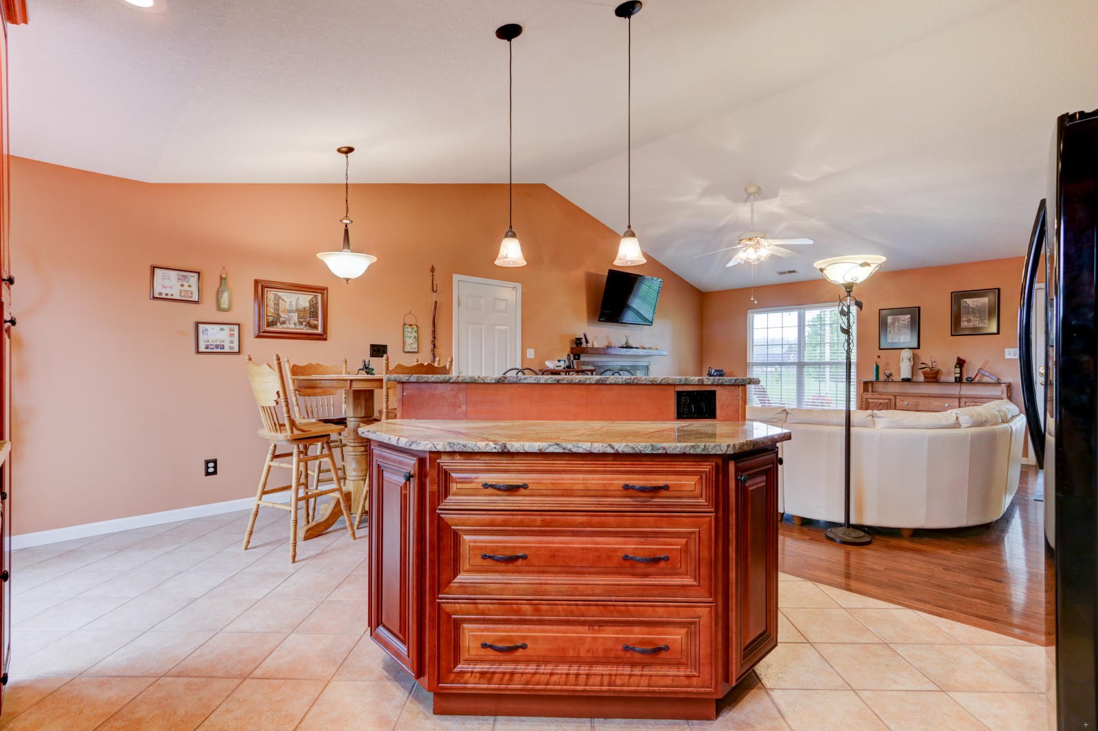 447 Pecan Circle Corryton, TN 37721 - Photo 7 of 28 a kitchen with a wooden floor and a view of living room