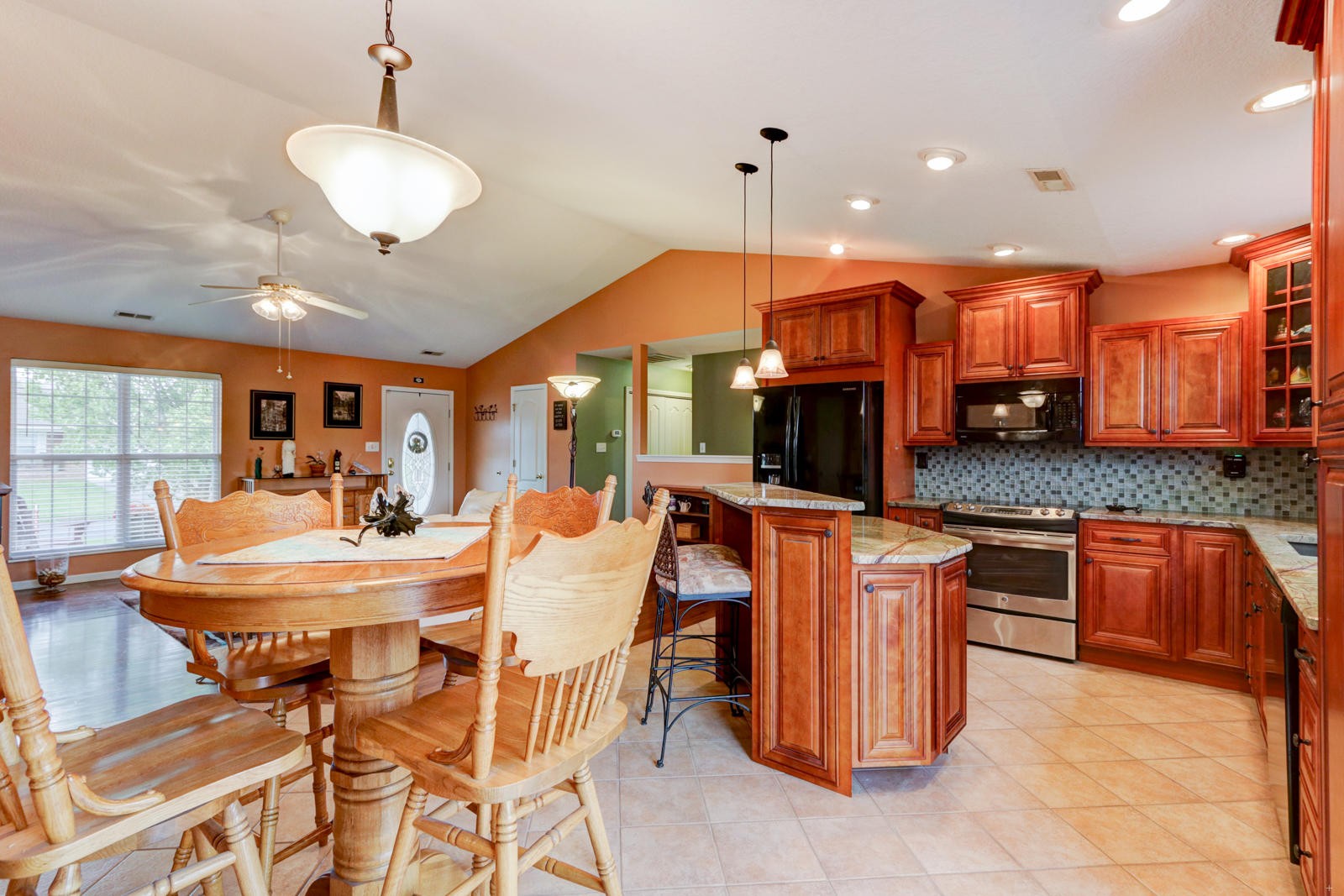 447 Pecan Circle Corryton, TN 37721 - Photo 8 of 28 a large kitchen with a table and chairs