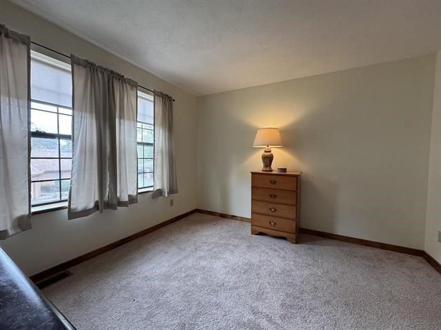 43 West Meadow Road, Unit 43 Haverhill, MA 01832 - Photo 29 of 42 an empty room with windows and closet