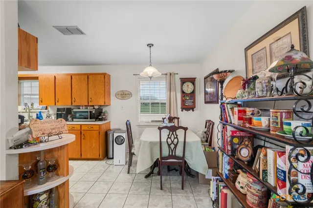 a very nice looking room with many windows and furniture