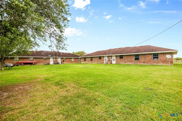a view of a house with a big yard