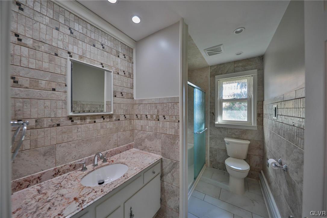 1288 Seifert Road Nazareth, PA 18064 - Photo 18 of 50 a bathroom with a granite countertop sink toilet and shower