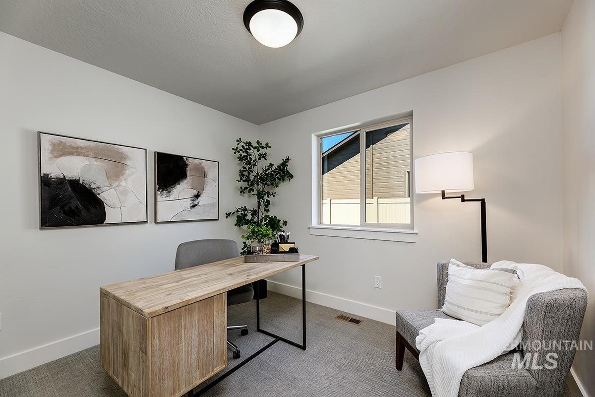 7151 South Skybreak Lane Meridian, ID 83642 - Photo 14 of 26 Dedicated room featuring light gray wall paint, white trim, and light gray carpeting
