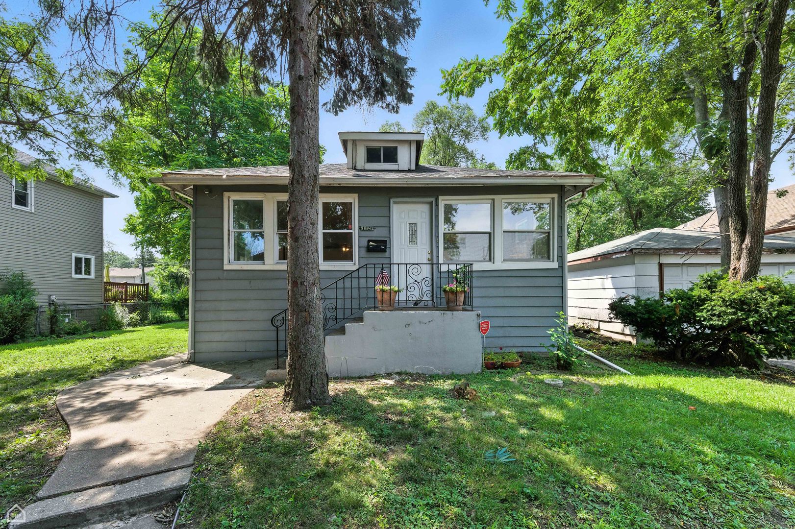 1121 West 104th Street Chicago, IL 60643 - Photo 1 of 17 front view of a house with a yard