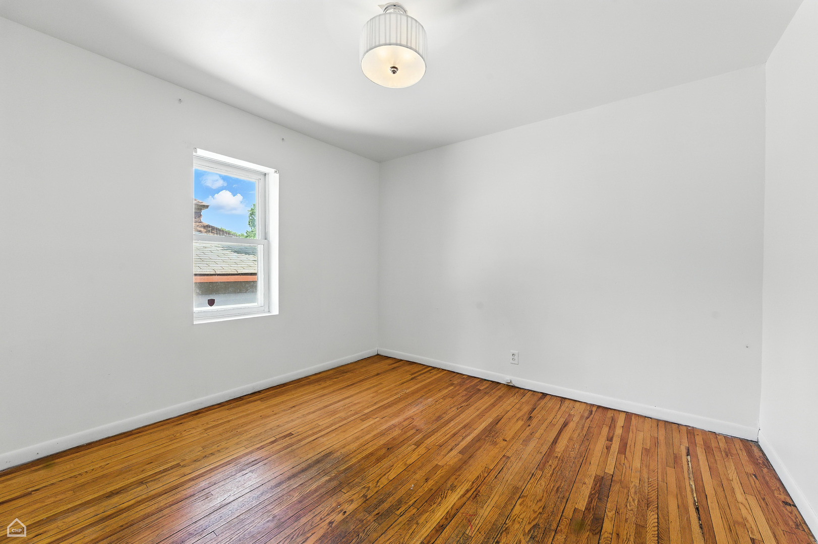 1121 West 104th Street Chicago, IL 60643 - Photo 11 of 17 a view of a room with wooden floor and window