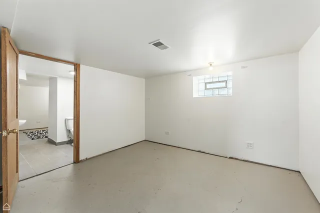an empty room with a bathroom