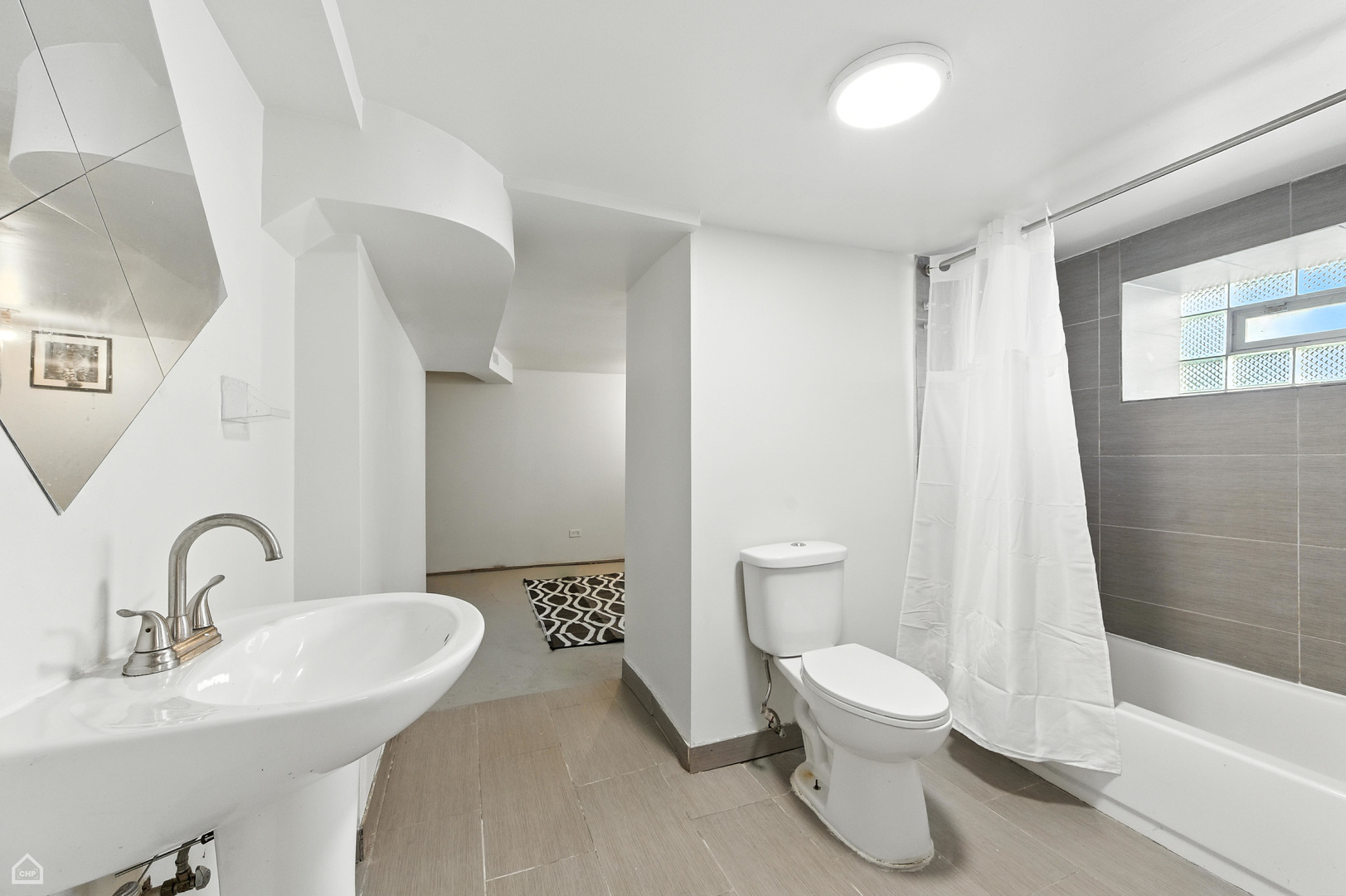 1121 West 104th Street Chicago, IL 60643 - Photo 10 of 17 a bathroom with a toilet sink and a mirror