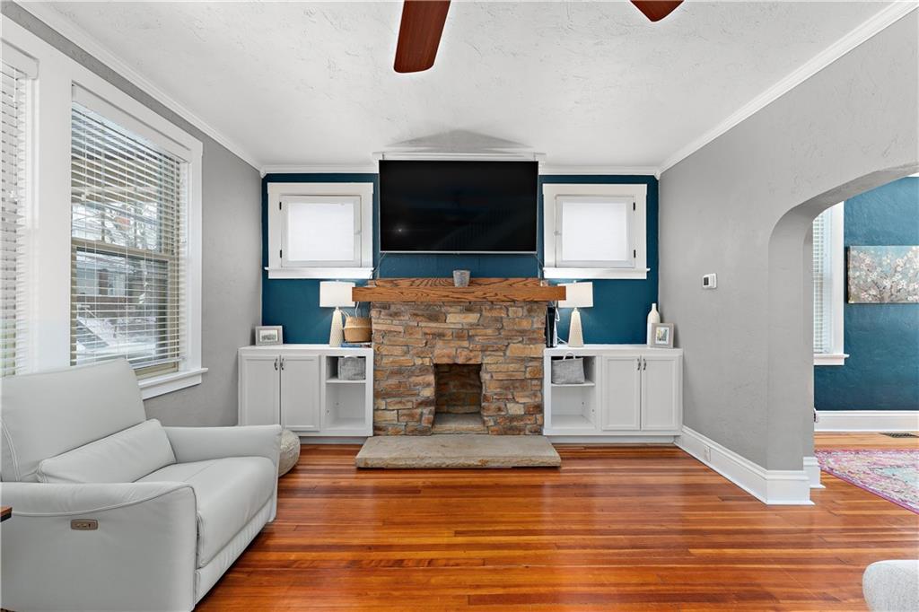 4101 Franklin Road Pittsburgh, PA 15214 - Photo 7 of 38 a living room with furniture a flat screen tv and a fireplace