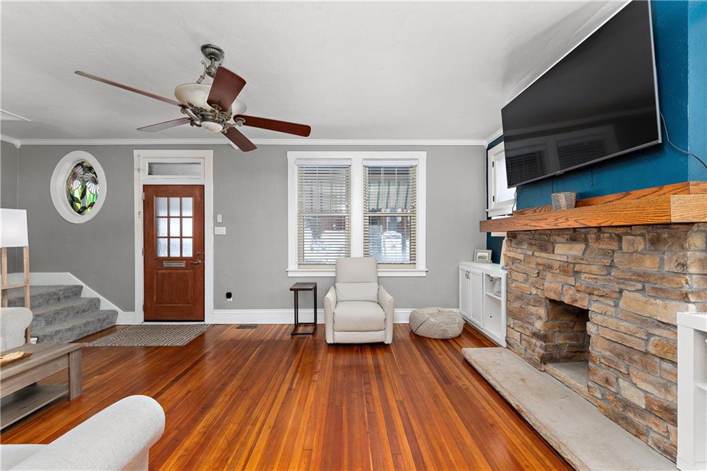 4101 Franklin Road Pittsburgh, PA 15214 - Photo 8 of 38 a living room with furniture a fireplace and a flat screen tv