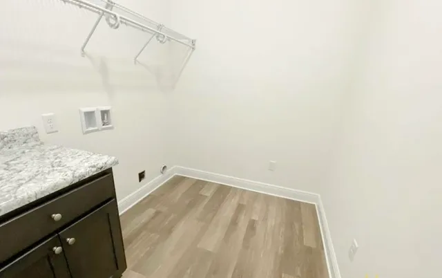 a view of a bathroom with a sink and a shower