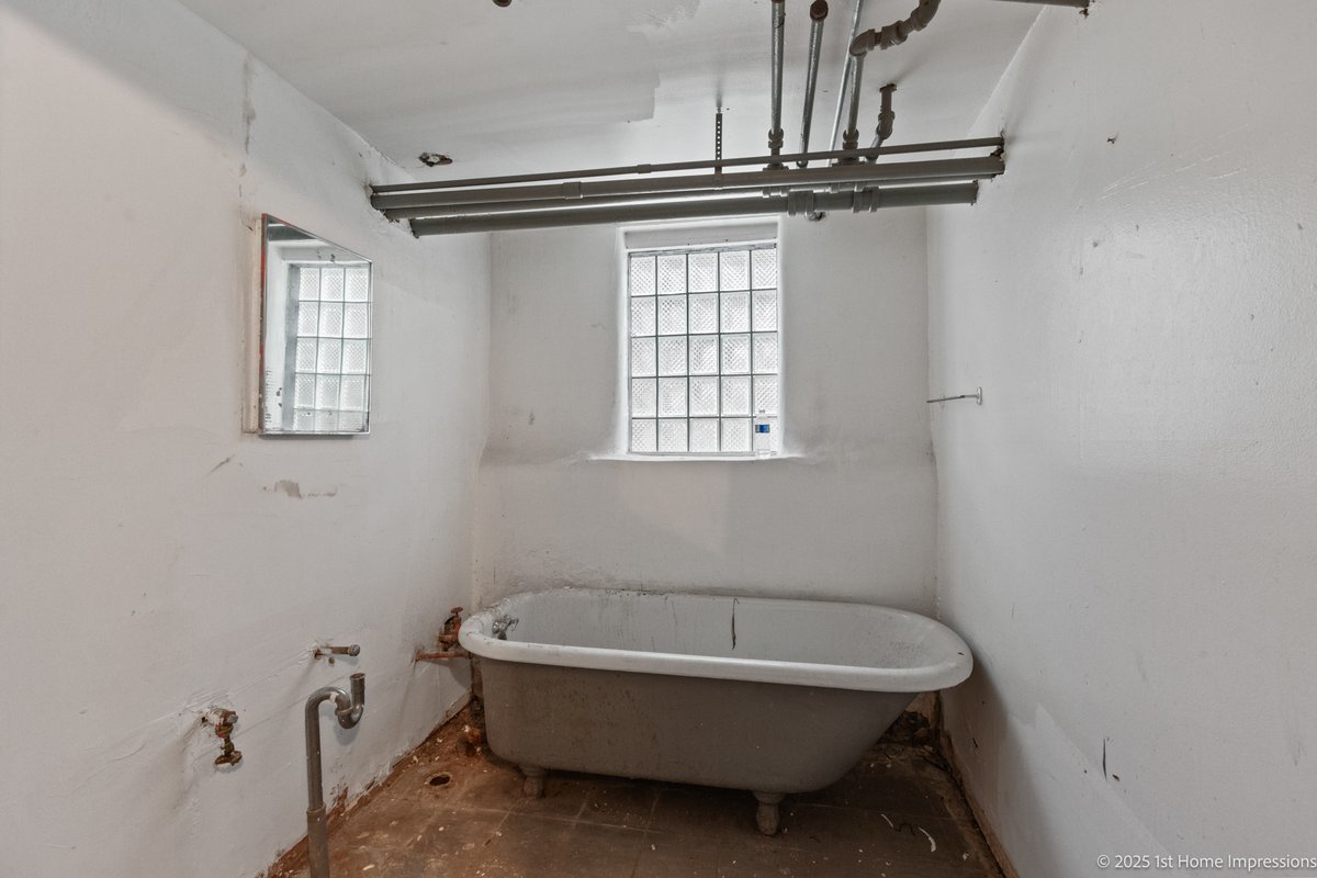 1833 South Troy Street Chicago, IL 60623 - Photo 17 of 18 a bathroom with a sink a toilet and a bathtub
