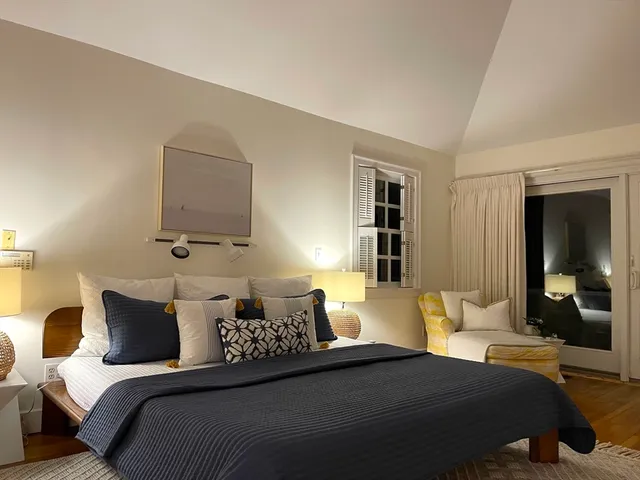 a view of a balcony with wooden floor and fence
