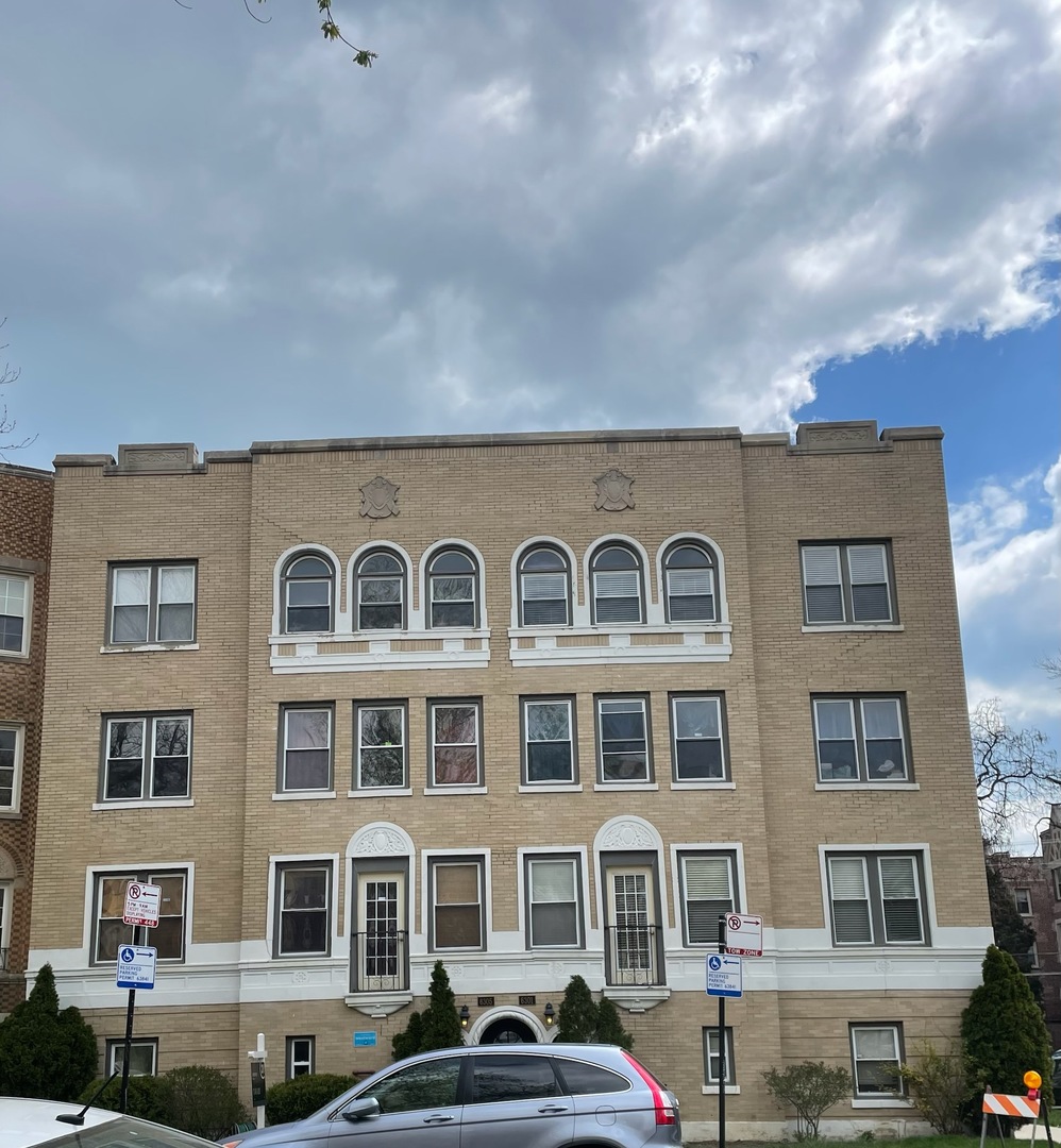 6301 North Talman Avenue, Unit G Chicago, IL 60659 - Photo 1 of 13 a front view of a residential apartment building