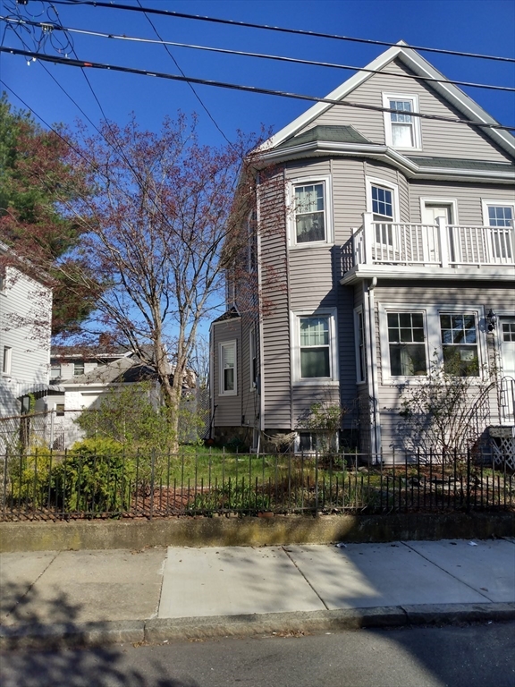 59 Chatham Road Everett, MA 02149 - Photo 1 of 3 a front view of a house with garage