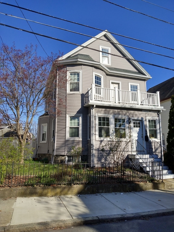 59 Chatham Road Everett, MA 02149 - Photo 3 of 3 a front view of a house with garden