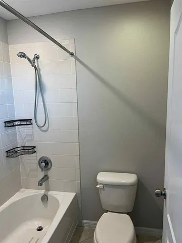 a bedroom with furniture and a chandelier