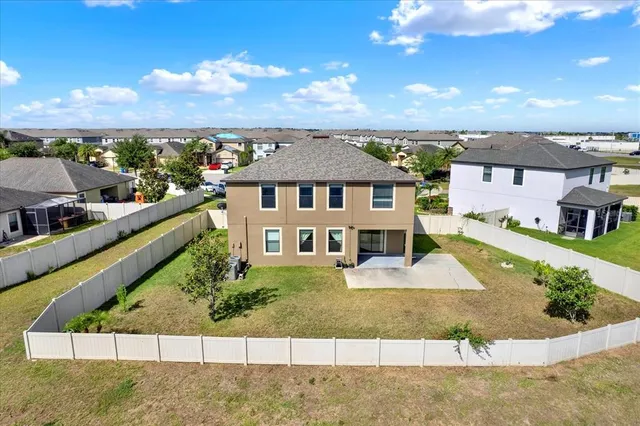 a view of a lake with houses in the background