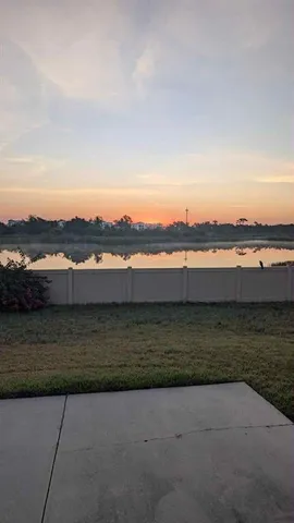 an aerial view of a house with a lake view