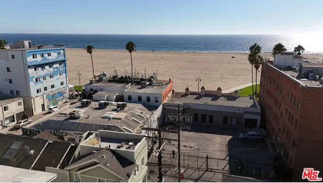 a terrace with outdoor seating and city view