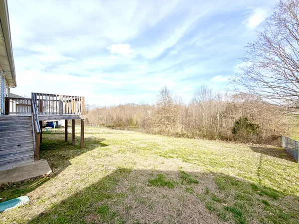 a house view with a big yard