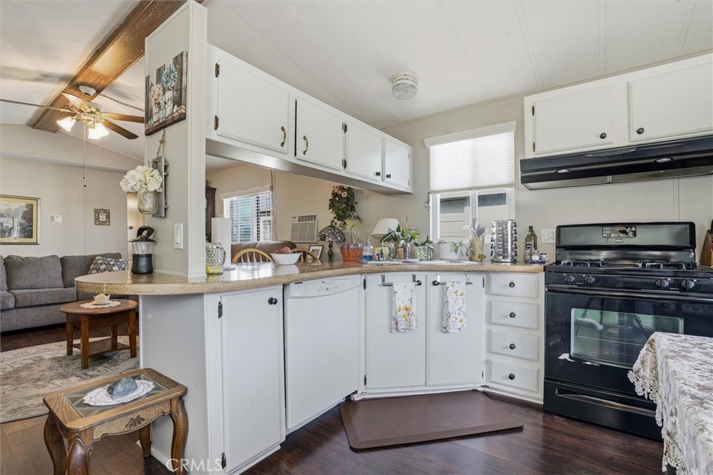 500 Atascadero Road, Unit D8 Morro Bay, CA 93442 - Photo 11 of 26 a kitchen with cabinets appliances and a counter space