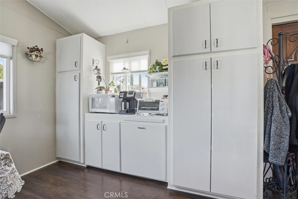500 Atascadero Road, Unit D8 Morro Bay, CA 93442 - Photo 12 of 26 a kitchen with stainless steel appliances white cabinets and a refrigerator