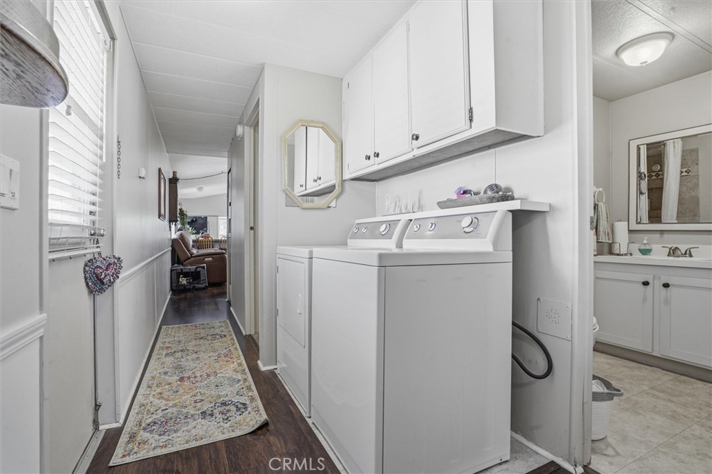 500 Atascadero Road, Unit D8 Morro Bay, CA 93442 - Photo 15 of 26 a utility room with cabinets washer and dryer