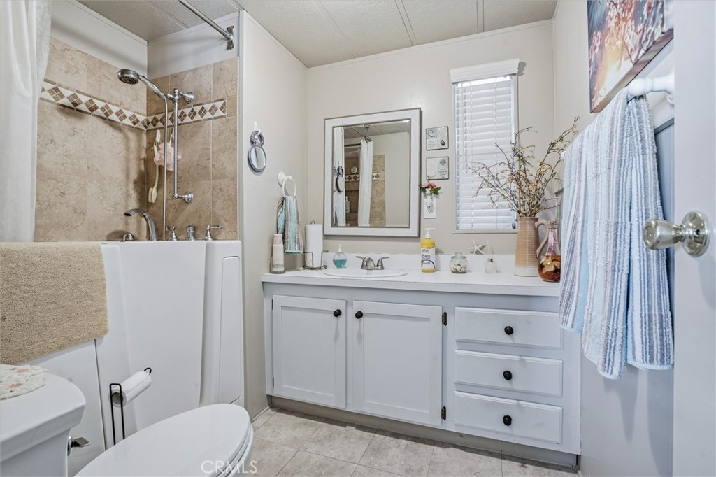 500 Atascadero Road, Unit D8 Morro Bay, CA 93442 - Photo 16 of 26 a bathroom with a sink a toilet and shower