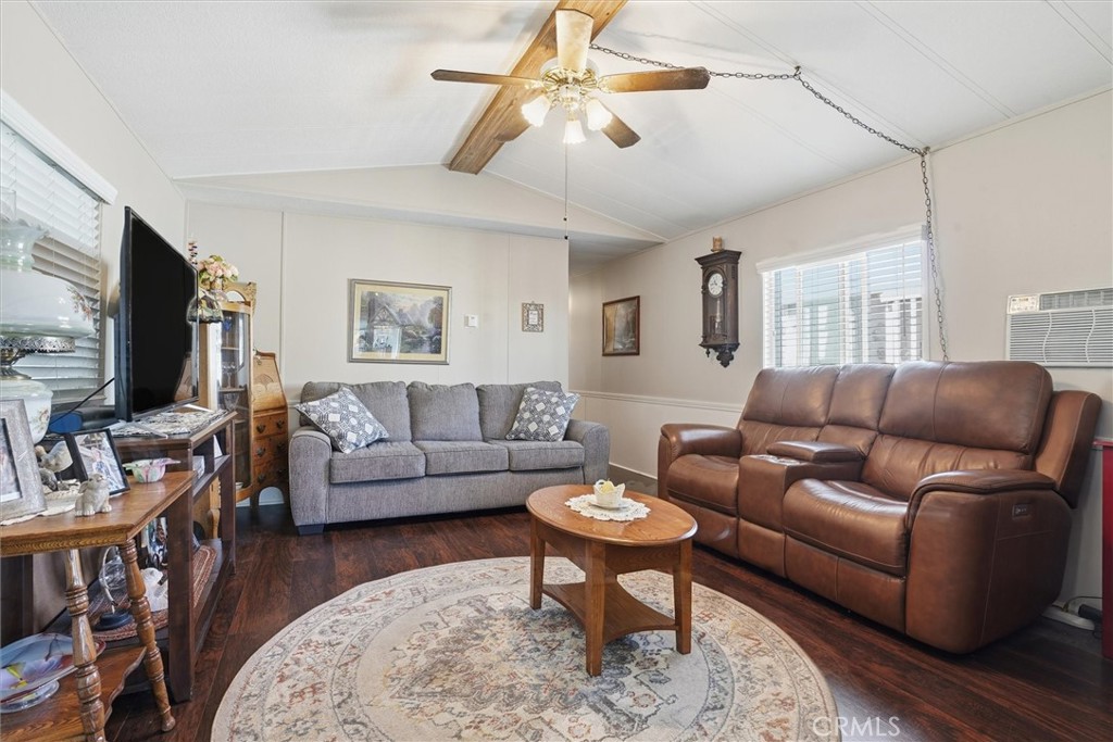 500 Atascadero Road, Unit D8 Morro Bay, CA 93442 - Photo 7 of 26 a living room with furniture and a flat screen tv