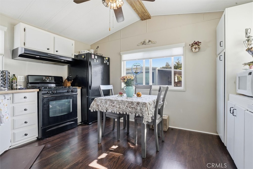500 Atascadero Road, Unit D8 Morro Bay, CA 93442 - Photo 10 of 26 a kitchen with granite countertop white cabinets and stainless steel appliances