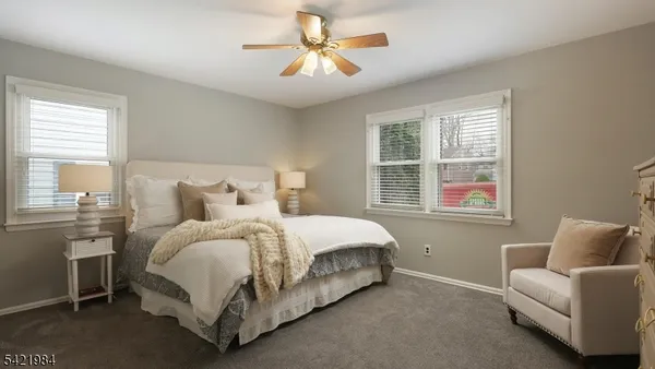 a spacious bedroom with a bed and a couch