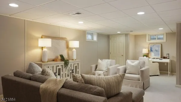 a living room with furniture and a table