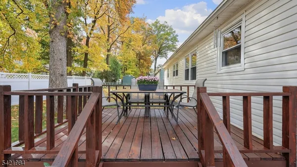a view of balcony with furniture and trees
