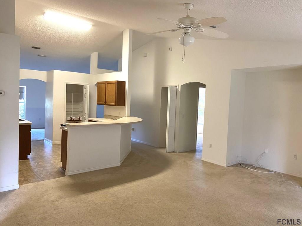62 Rae Drive Palm Coast, FL 32164 - Photo 2 of 24 Family Room View towards Kitchen