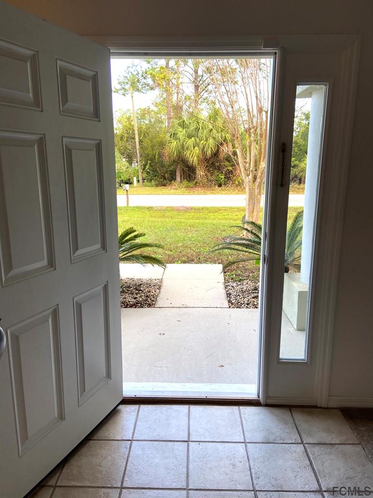 62 Rae Drive Palm Coast, FL 32164 - Photo 5 of 24 Front Door view to outside